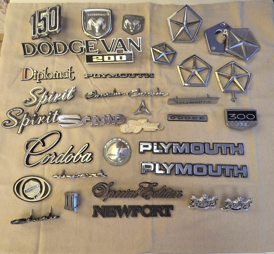 HUGE LOT OF MIXED MOPAR EMBLEMS. 33 TOTAL DODGE, PLYMOUTH, CHRYSLER