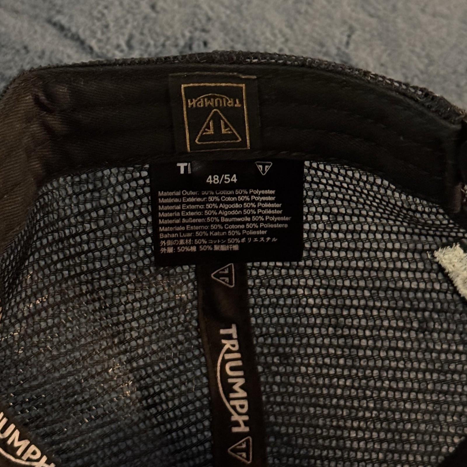 Triumph Taylor Embroidered Black & White Trucker Hat – MCAS21005