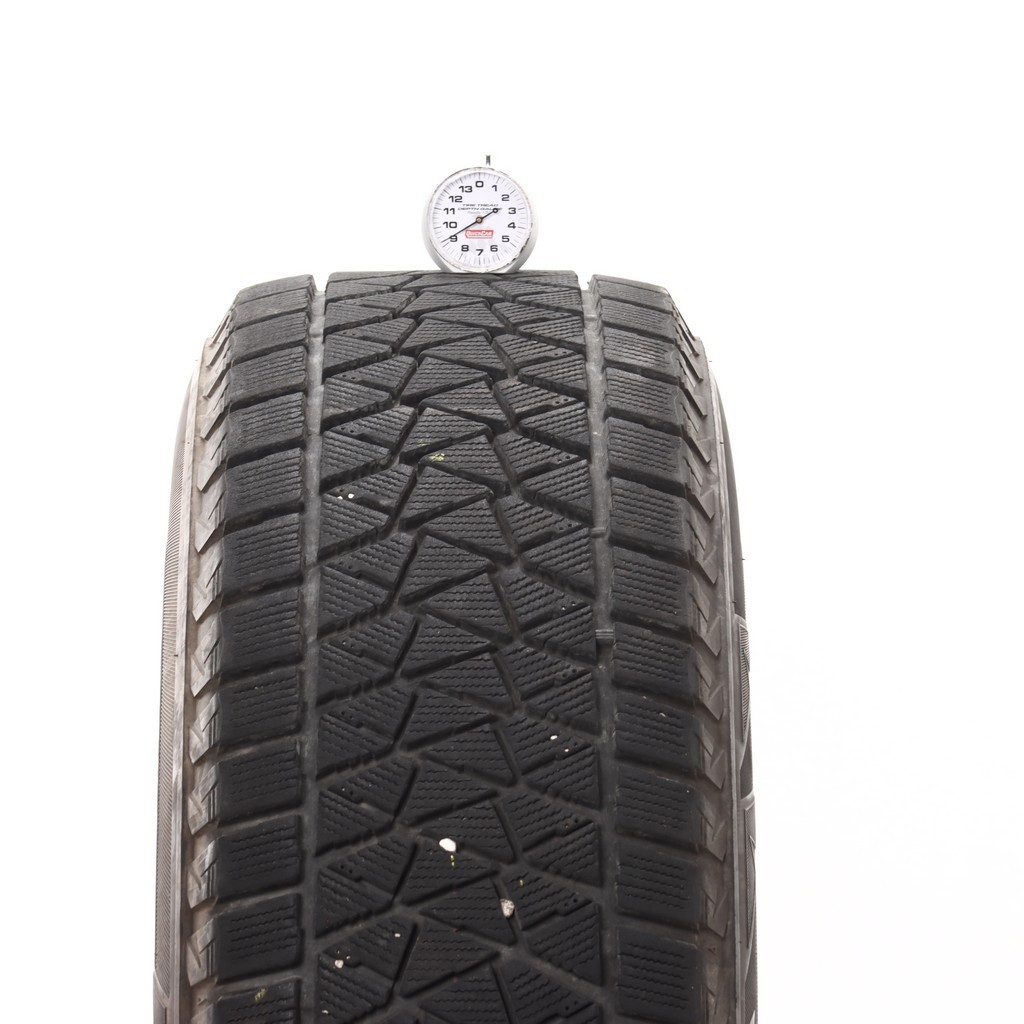 Set of (4) Used 235/65R17 Bridgestone Blizzak DM-V2 108S – 8-9/32
