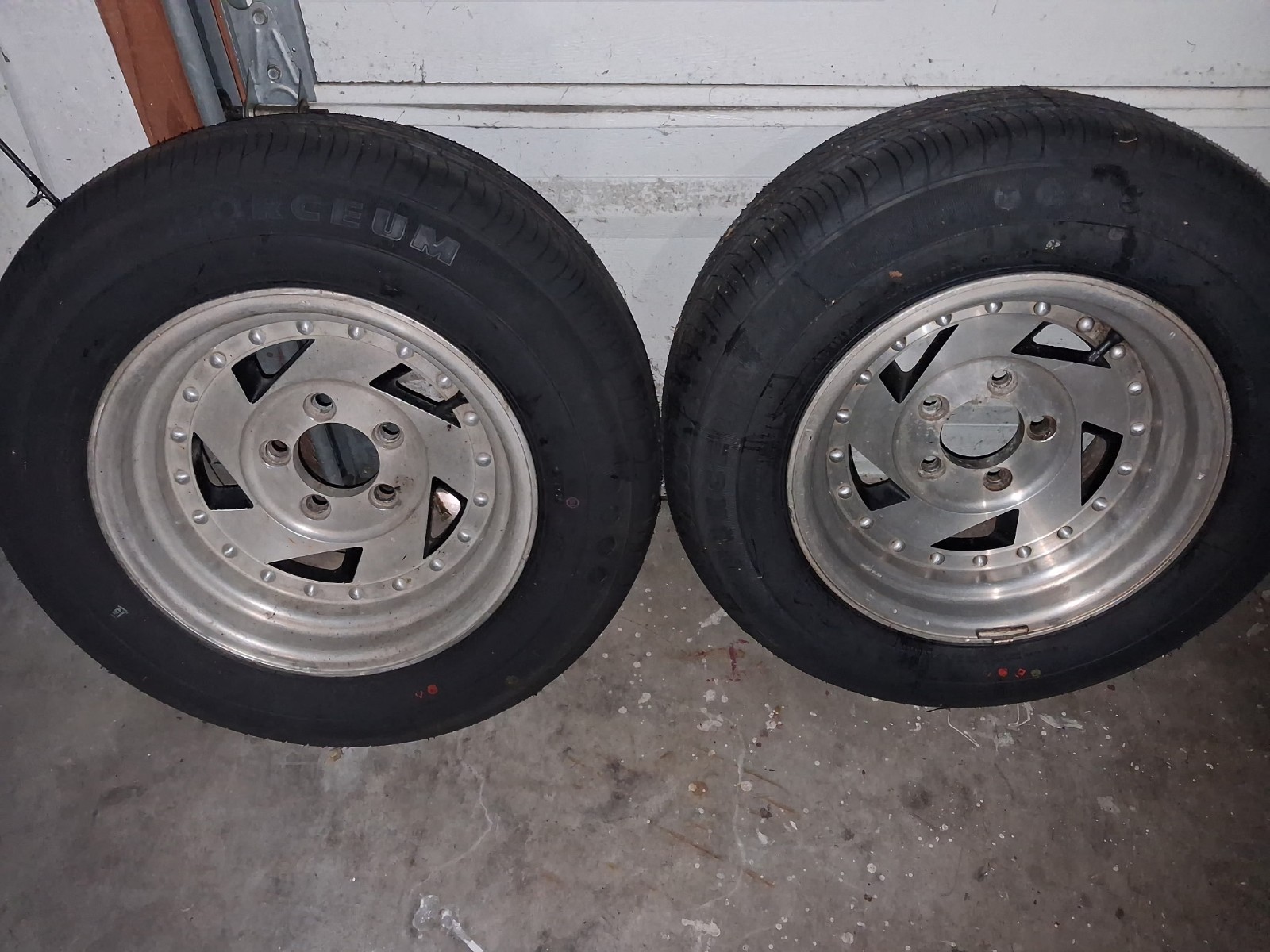 A pair of used wheels with BRAND NEW tires. 195 70r14 with a 5.5 lug pattern