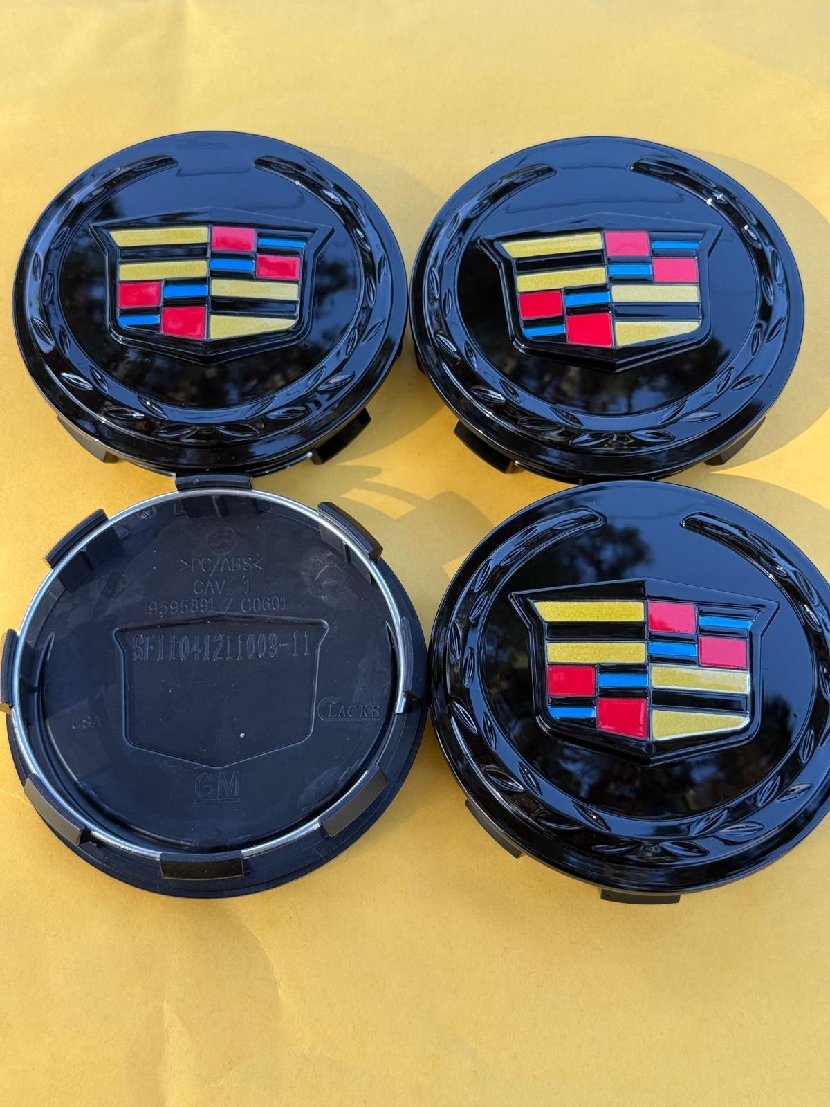 4 X Cadillac Black Center Caps 83MM, Satisfaction Guaranteed!