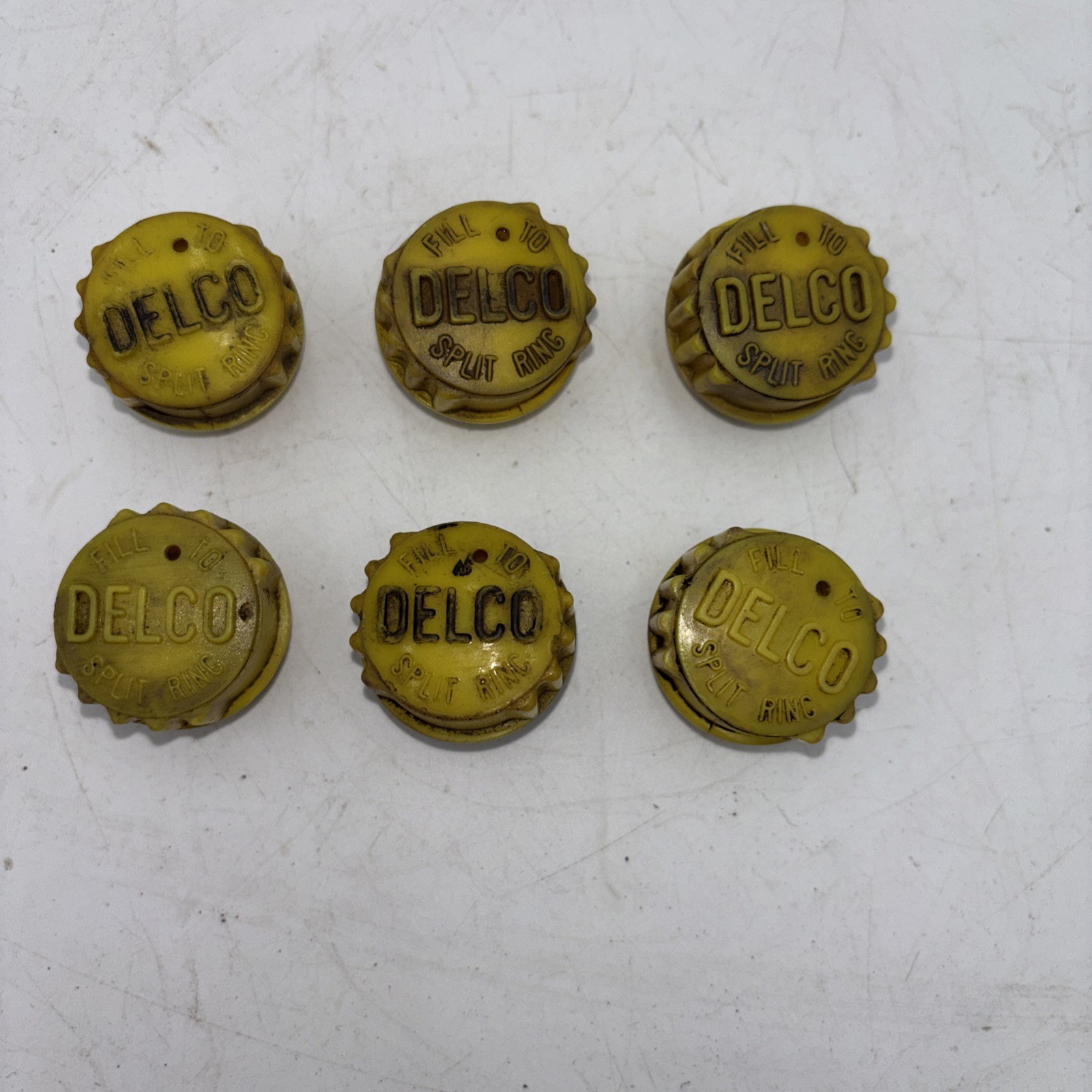 Vintage 1950s 1960s 1970s Delco-Remy battery caps used for lead-acid batteries.